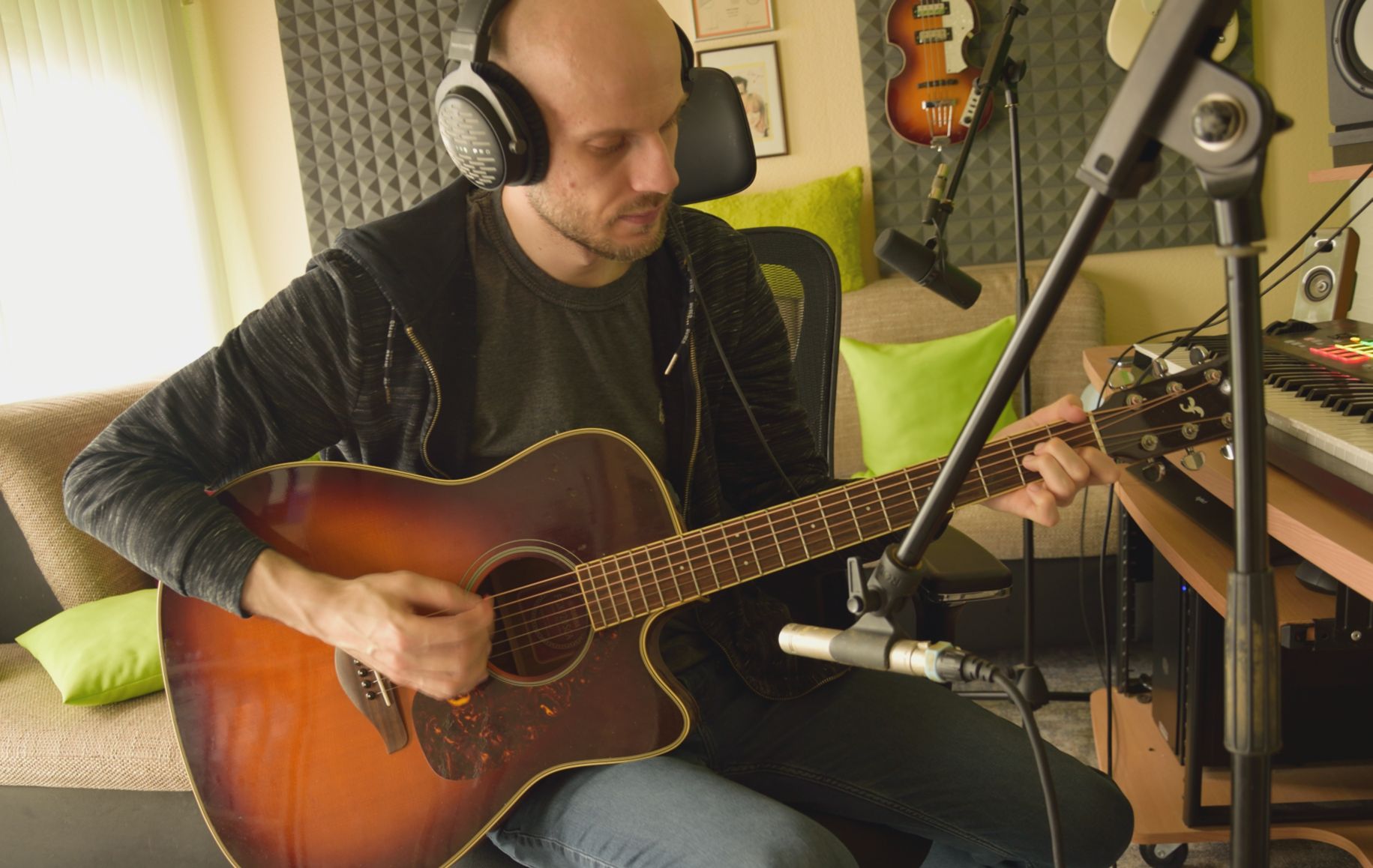 Recording the acoustic guitar for a new track.